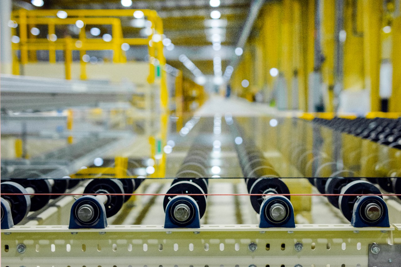 float glass on conveyors at the end of the float glass production line