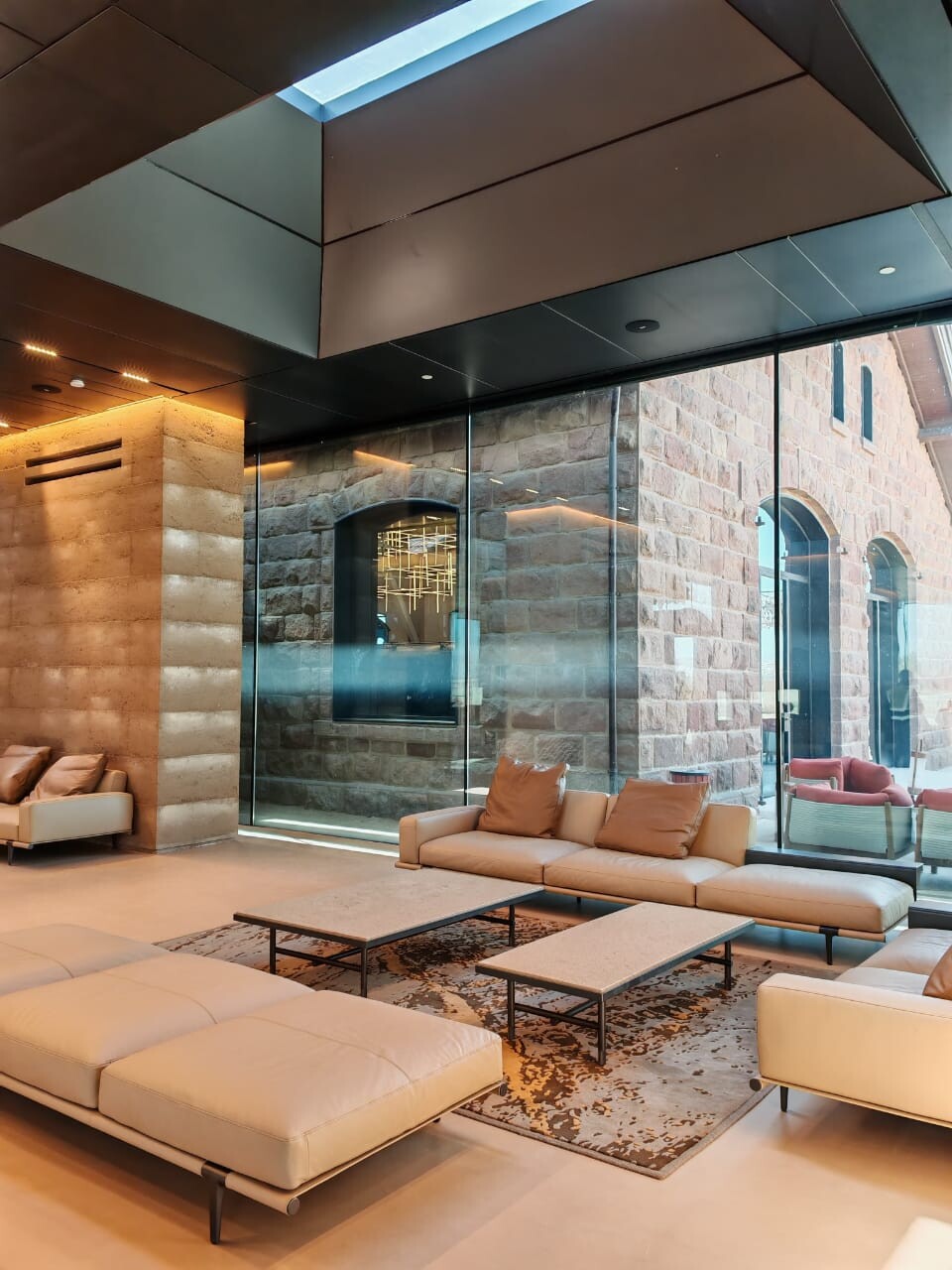 Situated within the UNESCO-designated site of Hegra, this unique luxury boutique hotel seamlessly combines ancient architecture with modern design, artistic spaces, and top-tier amenities.
Original structural and exterior walls, some constructed from mud brick, have been meticulously preserved and incorporated into the hotel’s contemporary architecture.
ClimaGuard™ HP Neutral 70 was chosen to glaze the facades of this project as it sets a new benchmark in durable, high-performance low-E glass. Intended for light commercial and residential use, Neutral 70 offers the optical clarity and energy efficiency typically linked to sputter coatings.