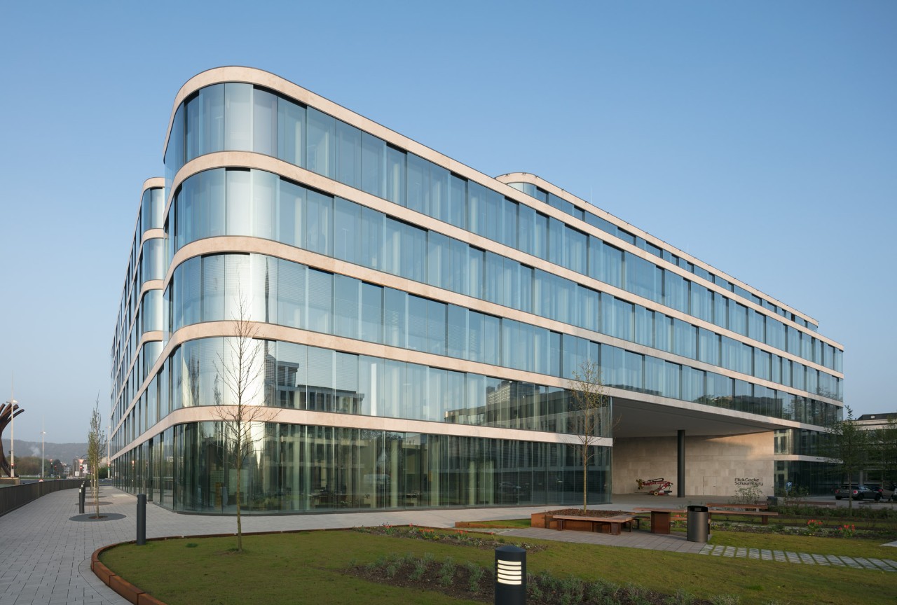 Modern institutional glass building facade representing financial architecture